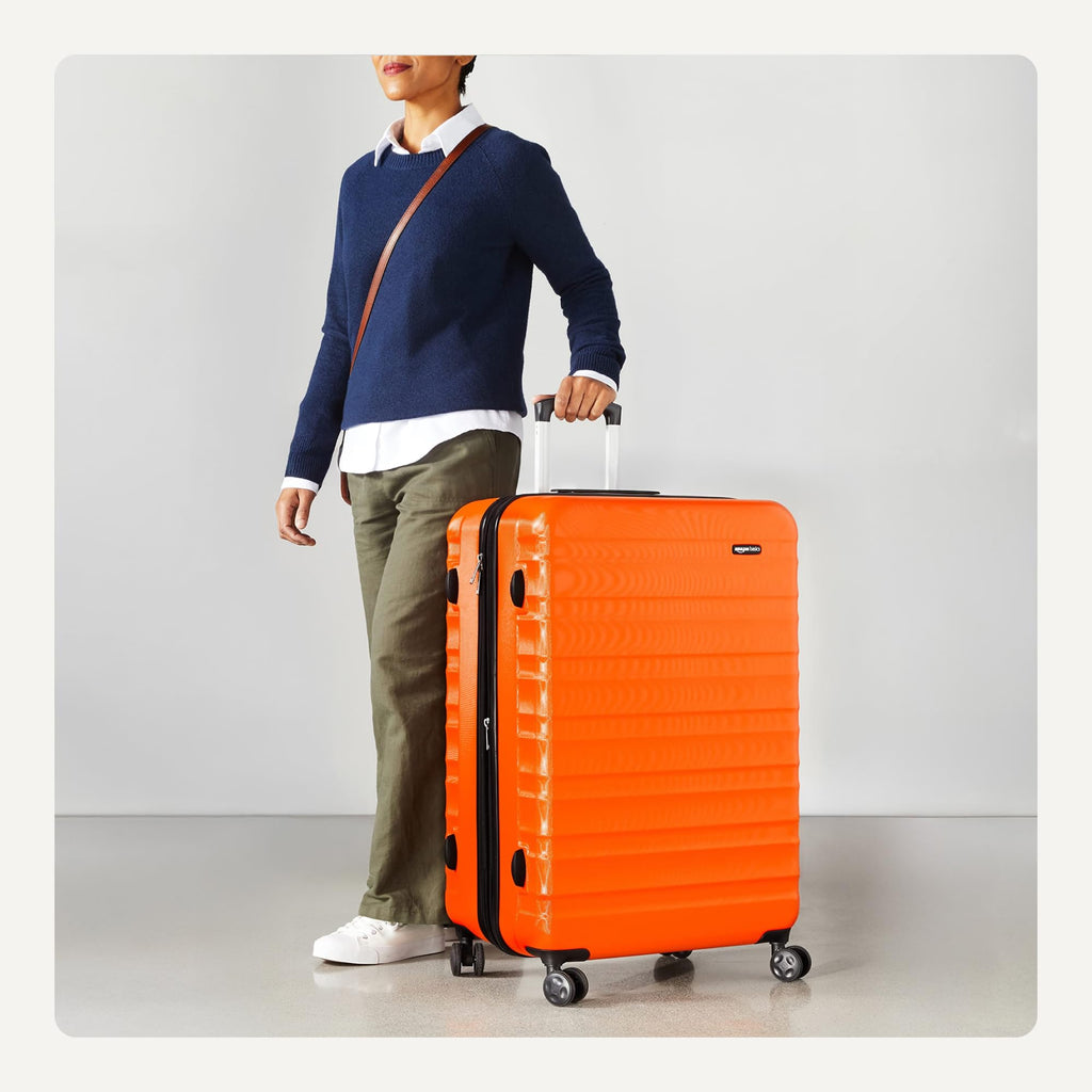 Amazon Basics 30" Hardside Large Checked Luggage, Hardshell Suitcase With Four Multi-directional Wheels, Expandable For Up to 15% More Space, Scratch-Resistant Shell, Black